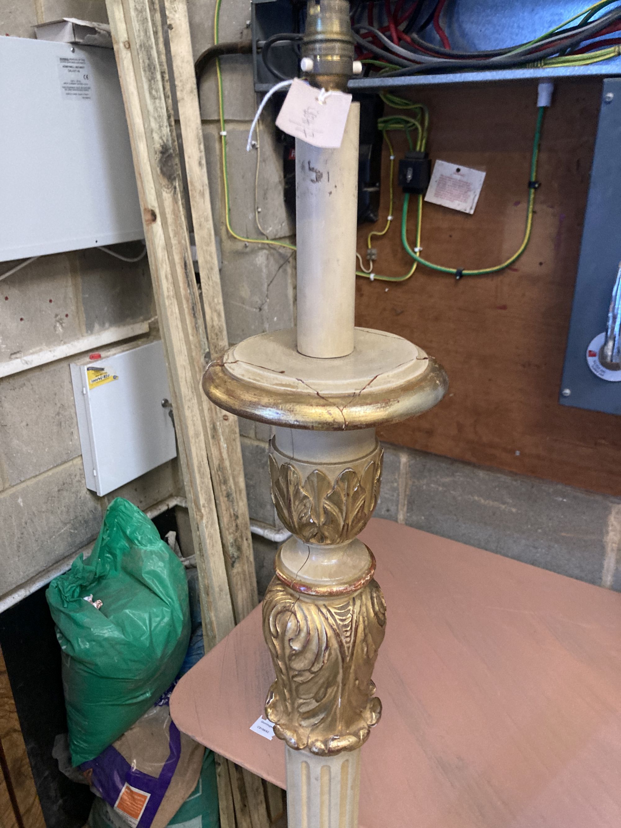A pair of cream painted parcel gilt standard lamps, height 166cm